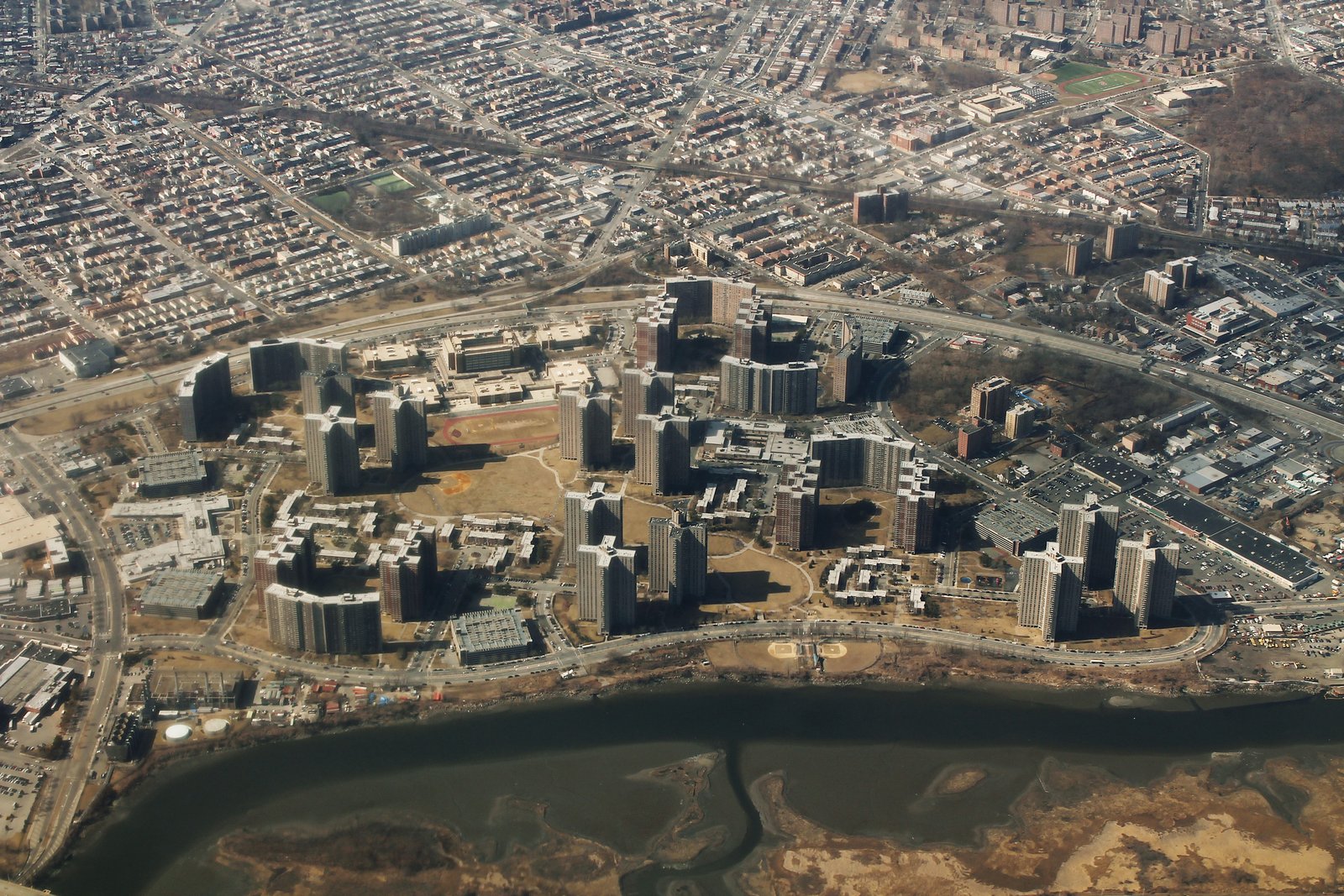 An aerial view of Co-op City’s apartment towers, townhouse groups and riverfront landscape, photographed in 2013.