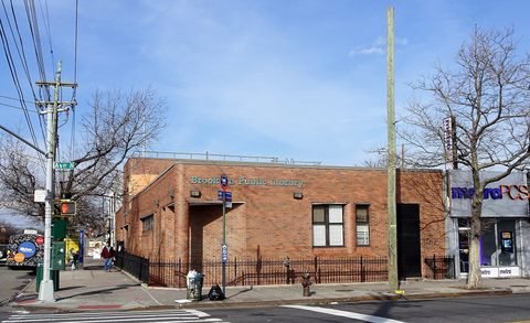 The brick library branch seen across Avenue N.