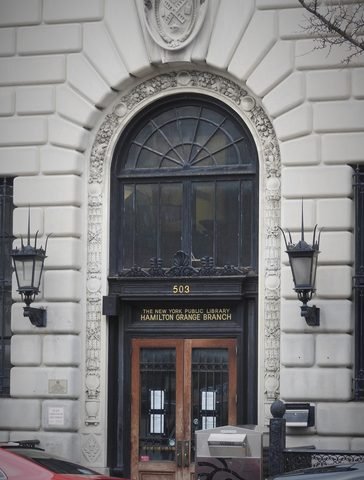 The arched entrance to the Hamilton Grange branch of the New York Public Library.