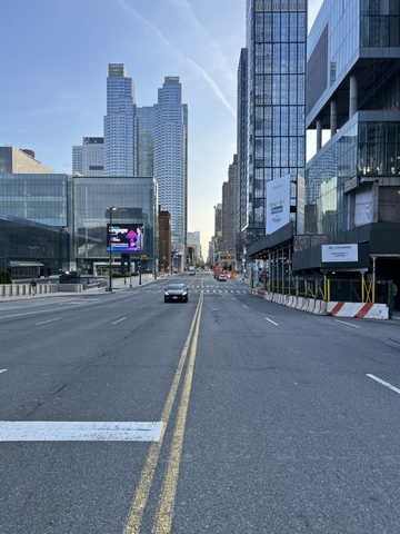 A view along 11th Avenue past the Javits Center and Hudson Yards buildings.