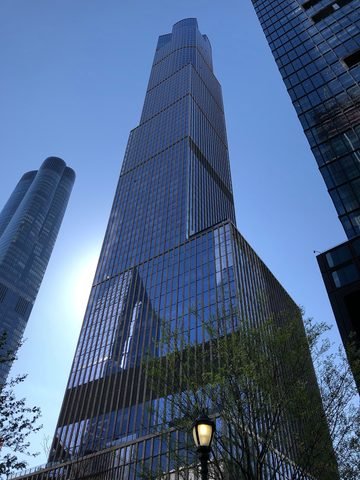 The 35 Hudson Yards tower rises above trees and neighboring buildings.
