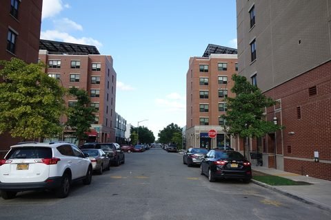 Apartment buildings and parked cars on Egan Street.