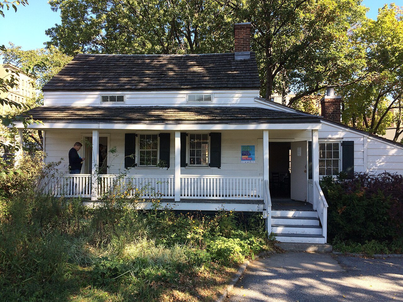 The small white Edgar Allan Poe Cottage in Poe Park in the Bronx