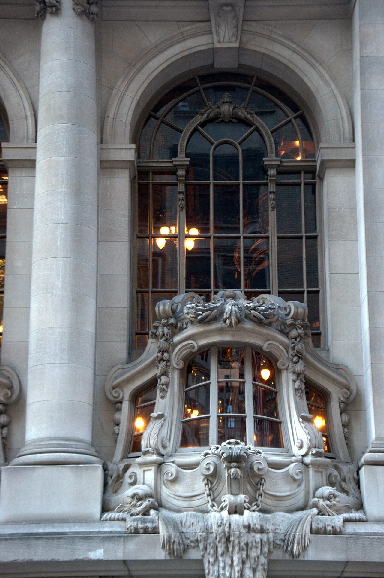 A ship-stern-shaped window and maritime stone carving on the New York Yacht Club in 2012