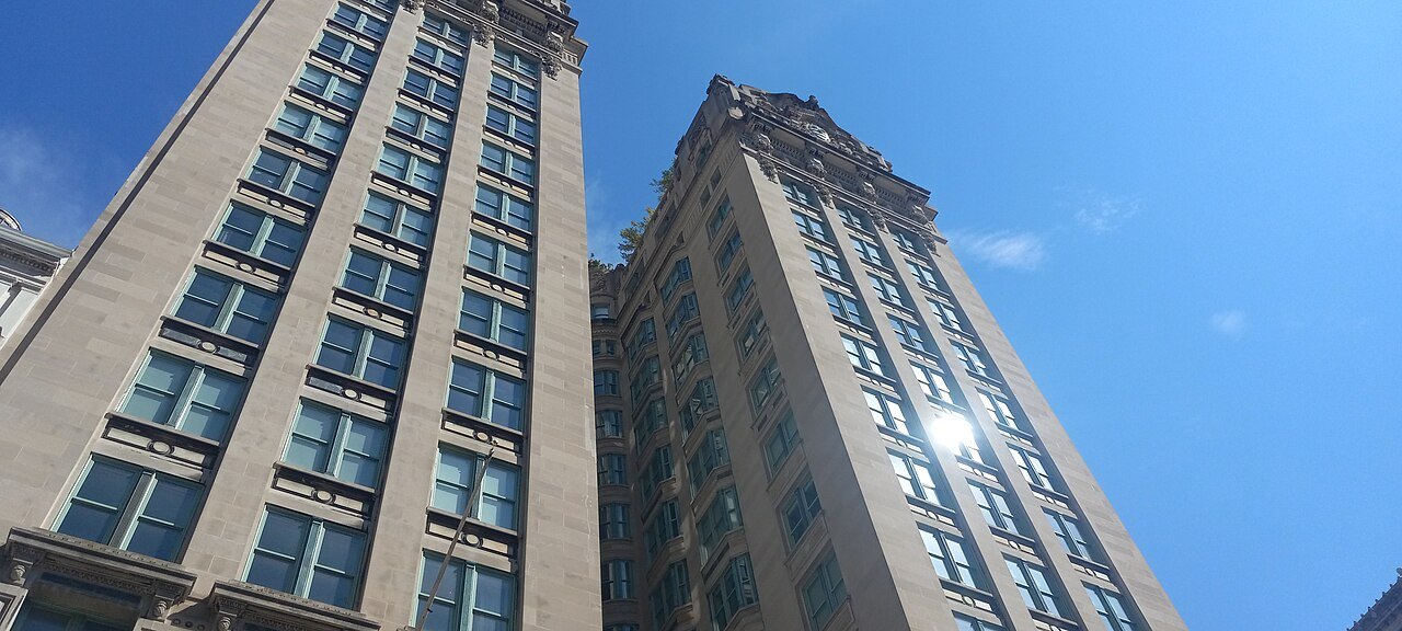 Emigrant Industrial Savings Bank's two upper wings and deep central recess in 2024