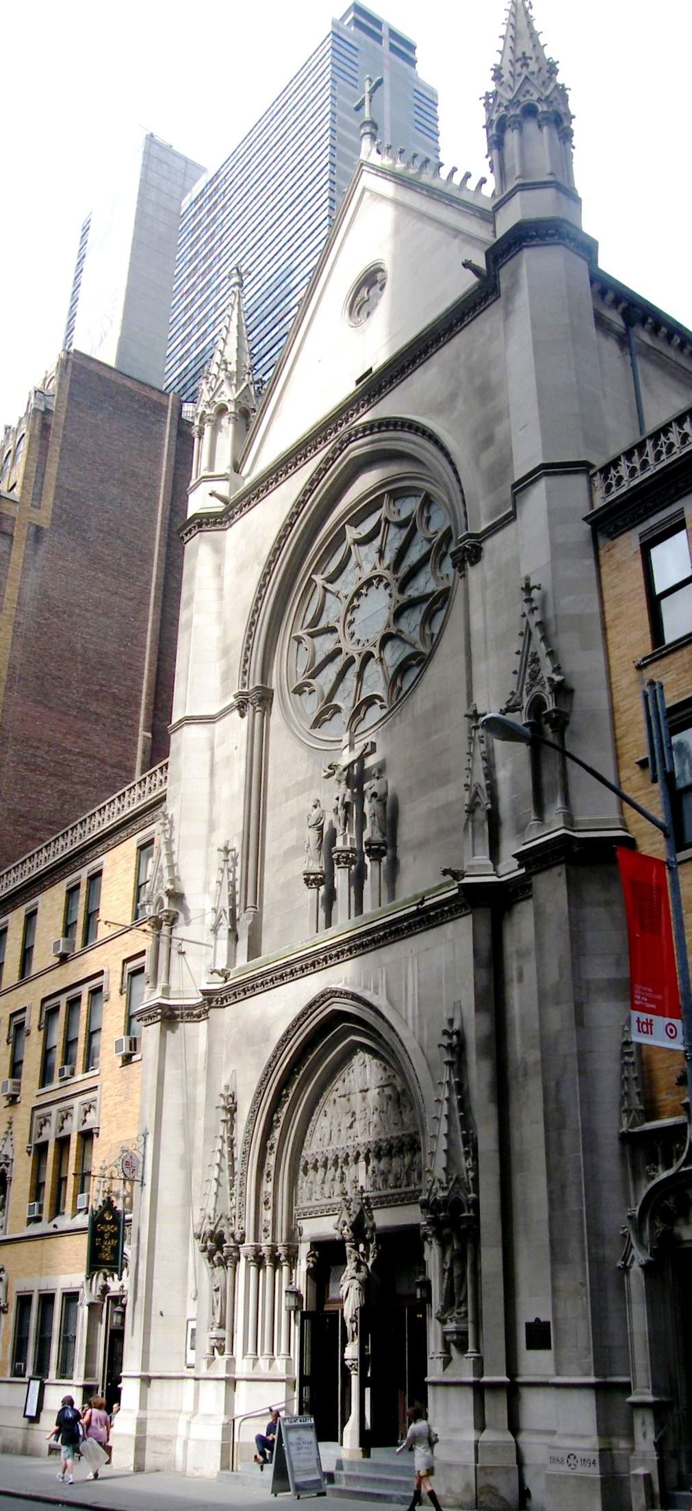 Church of Saint Mary the Virgin's pointed entrance, circular window and carved facade on West 46th Street