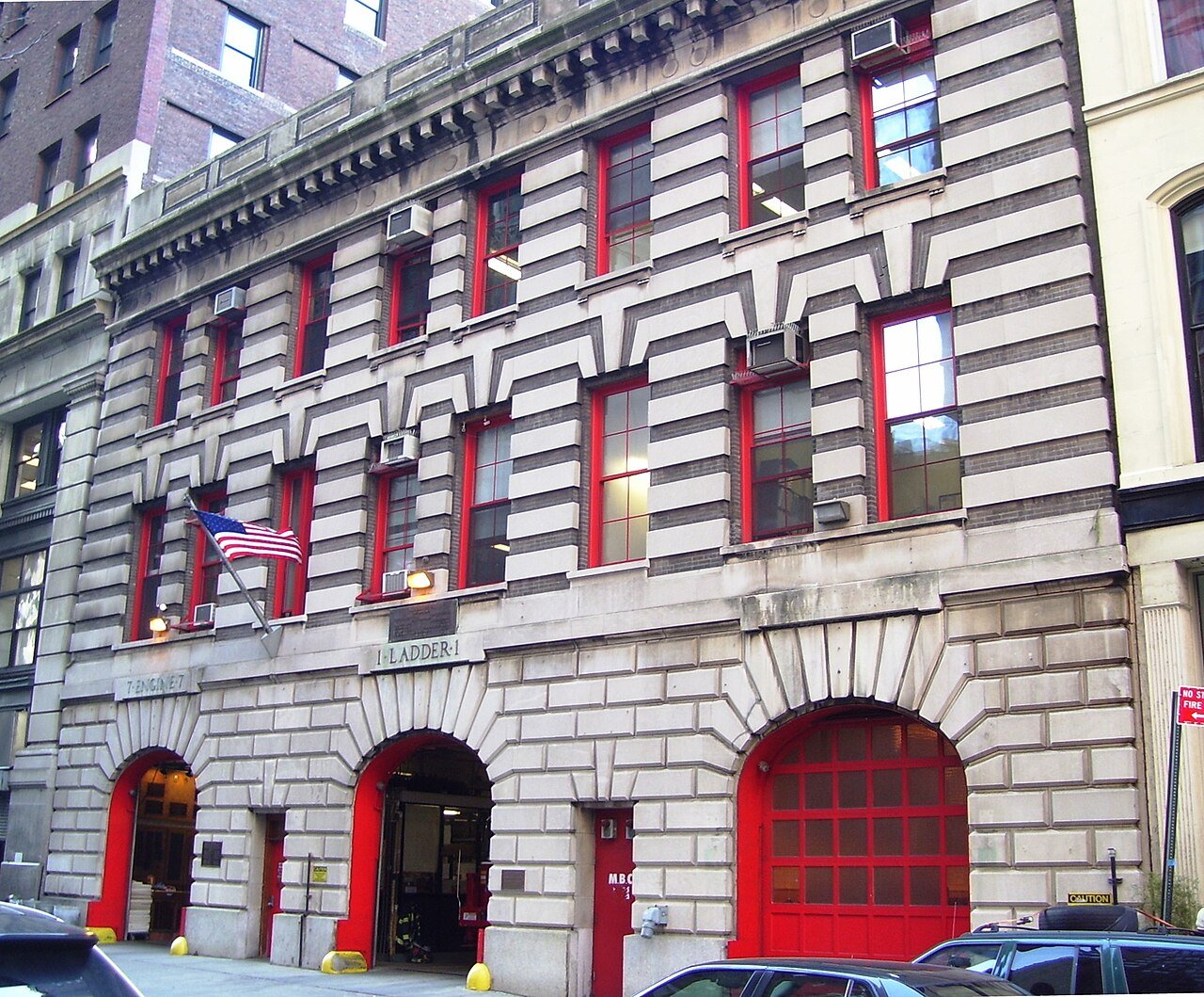 Engine 7 and Ladder 1 firehouse's three red apparatus doors on Duane Street in 2012