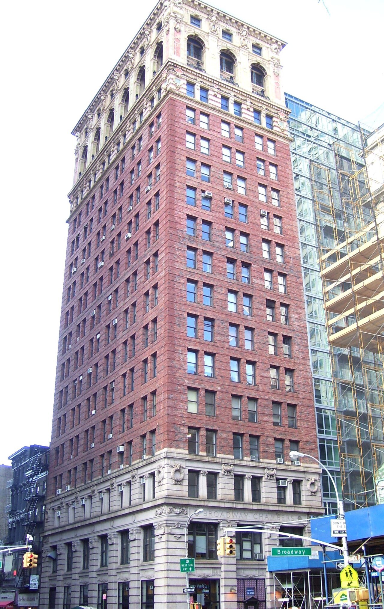 Broadway-Chambers Building's red brick shaft and decorated upper stories