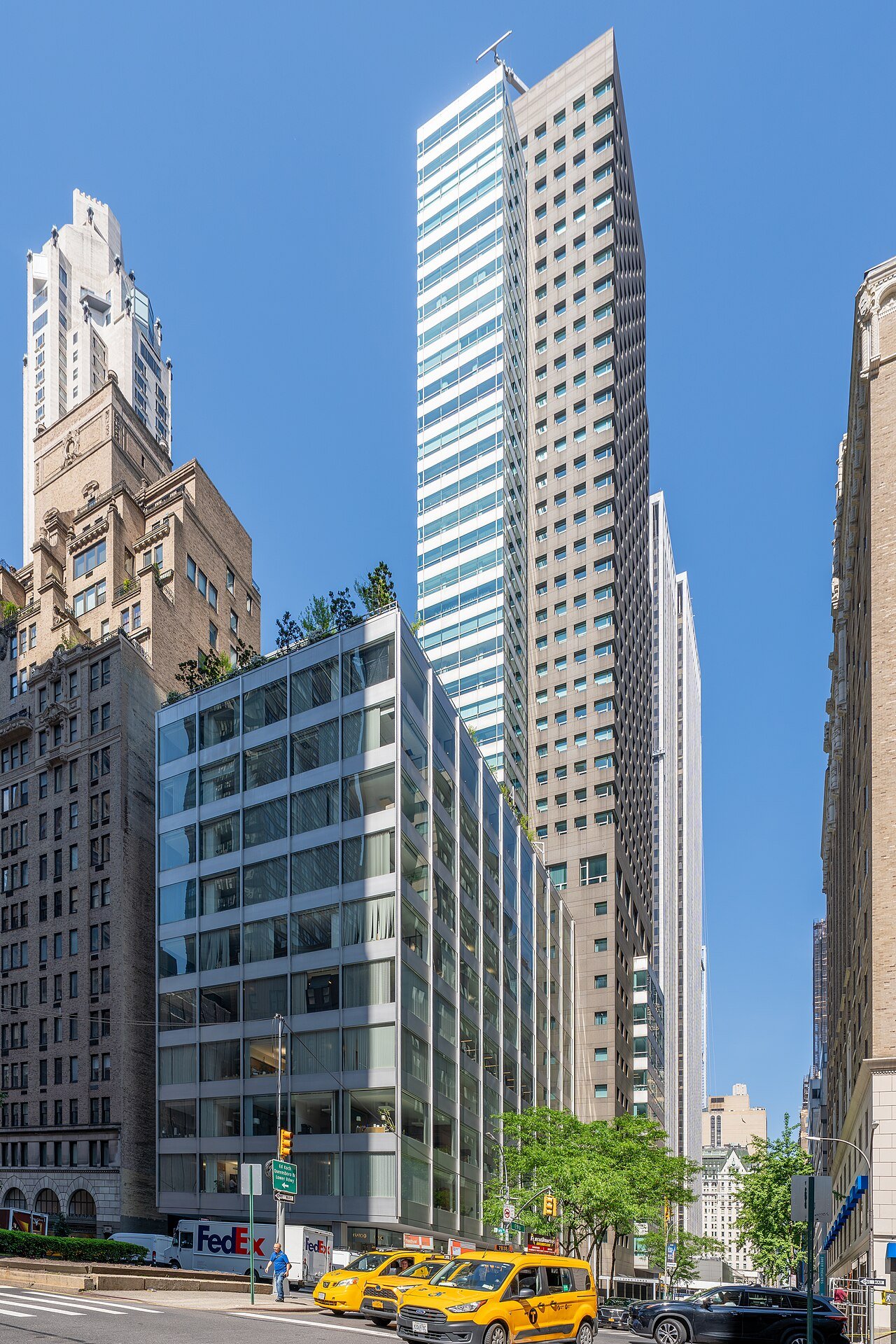 Original low Pepsi-Cola Building at the left foreground of 500 Park Avenue, beside a later tower, in 2026