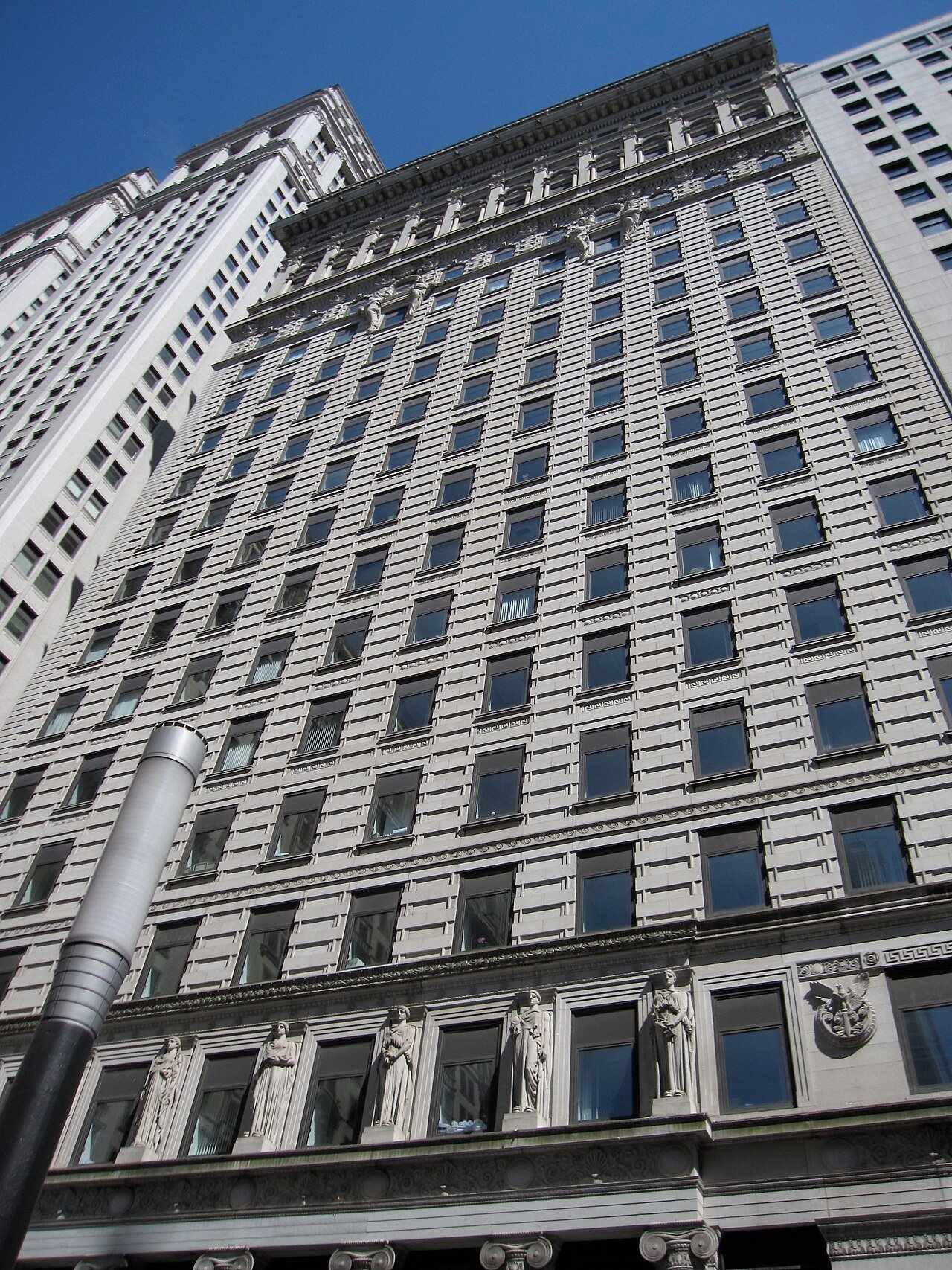 American Surety Building's stone facade and sculpted lower stories at 100 Broadway