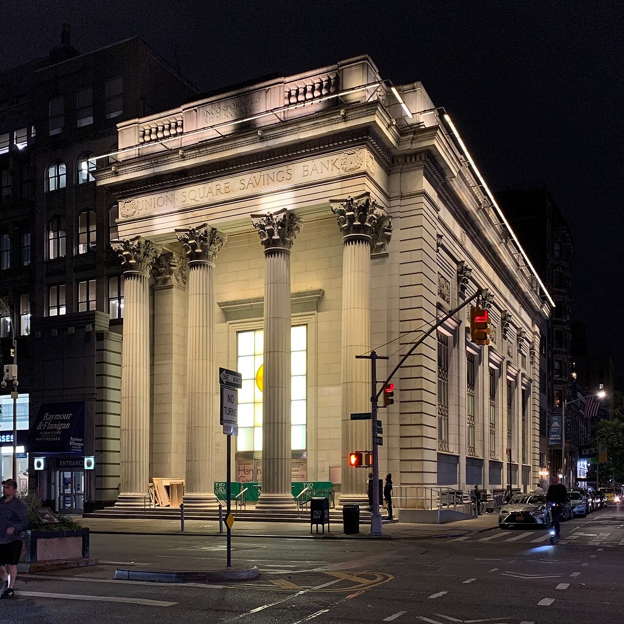 Former Union Square Savings Bank, now Daryl Roth Theatre, lit at night in 2019