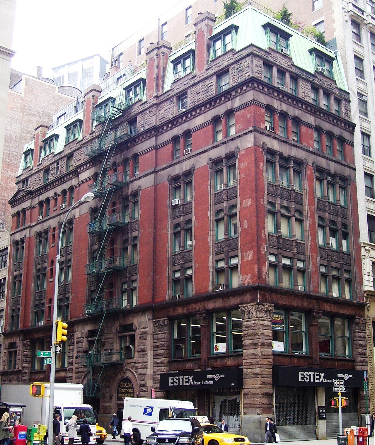 The Wilbraham, showing rough stone, red brick and its steep roof in 2011