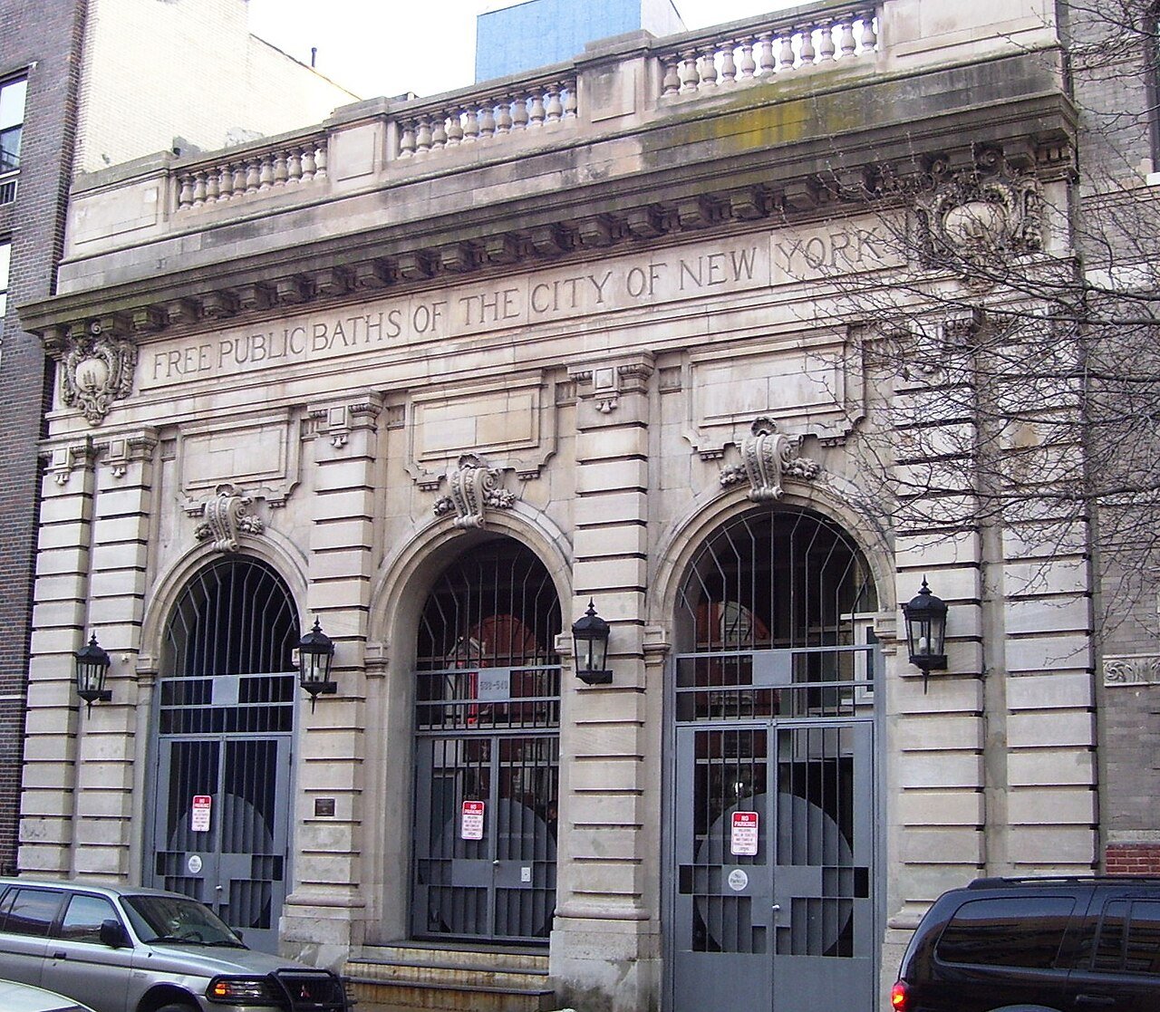 Former East 11th Street bathhouse with its three arches and carved public-baths inscription in 2011