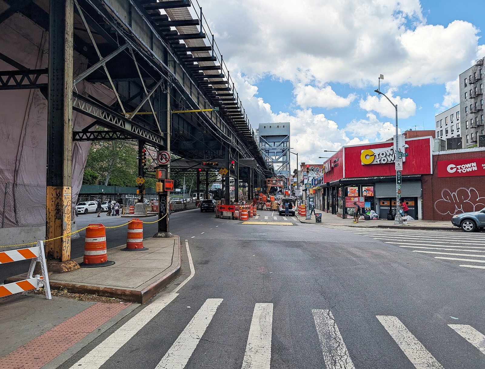 Broadway runs beneath the elevated subway at West 228th Street in Marble Hill.